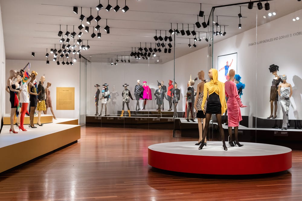 Mannequins wearing Patrick Kelly dresses in de Young museum gallery