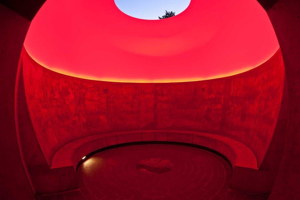 James Turrell's Three Gems skyspace with red lighting