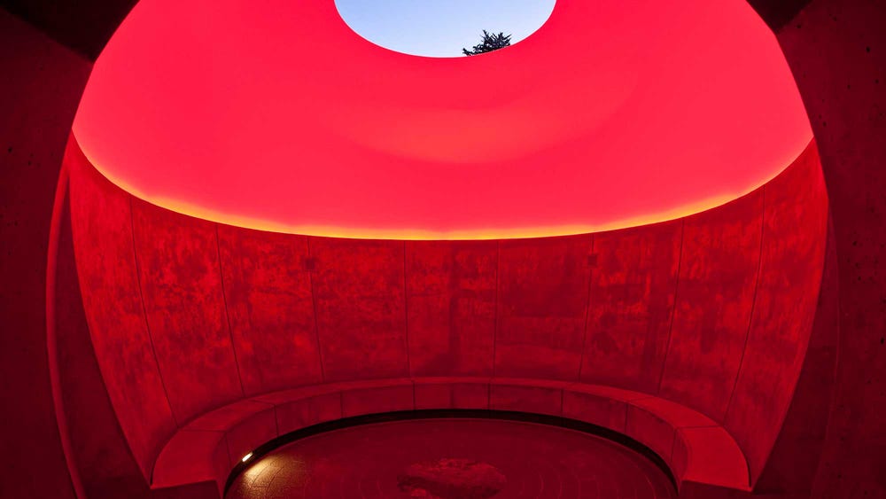 James Turrell's Three Gems skyspace with red lighting