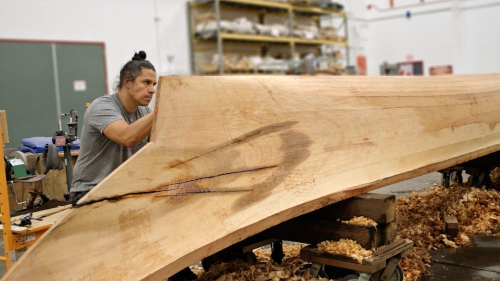 Person working on a large wooden project