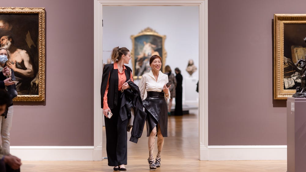 two women walking through the Legion of Honor galleries