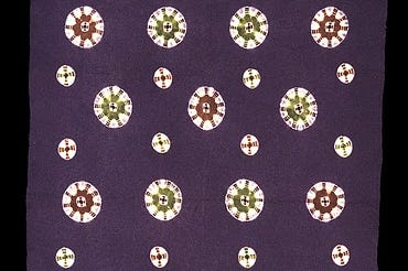 Purple mat with green and red pattern.