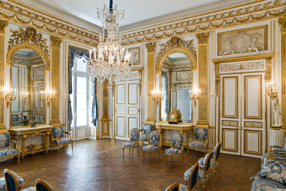 elaborate room in white, gold, and blue