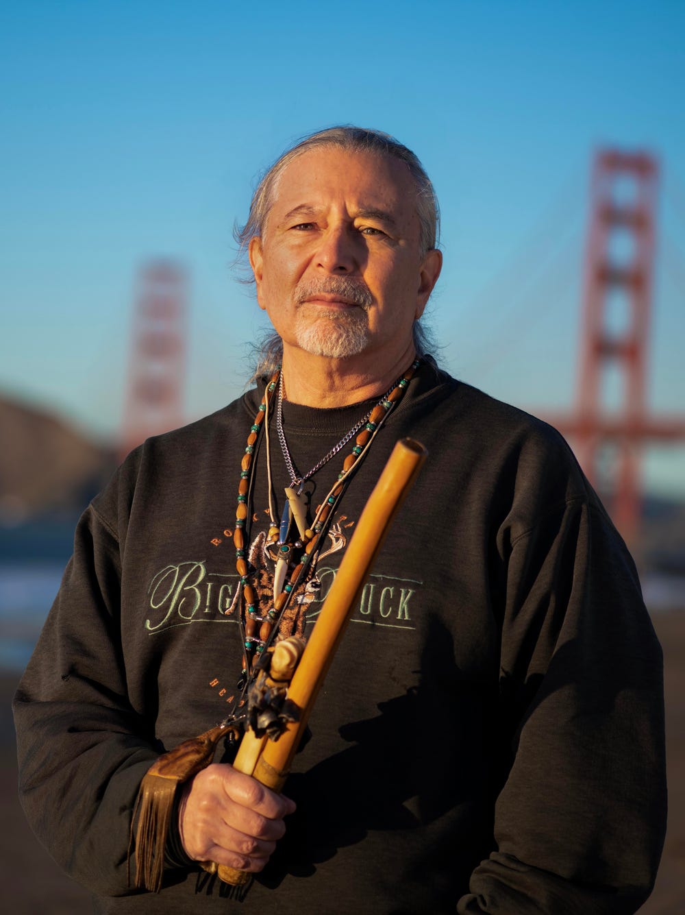 Gregg Castro standing in front of the Golden Gate Bridge