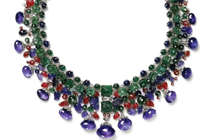 Necklace with green, blue, and red beads.