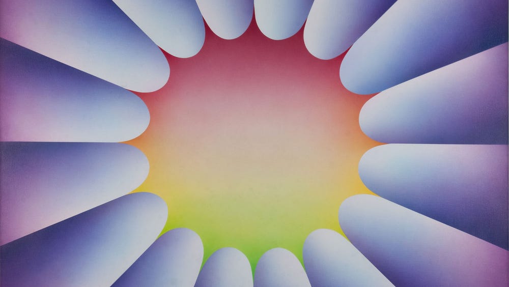 purple cylindrical shapes orbiting around a red, yellow, and green center