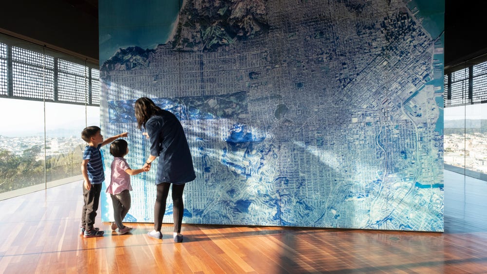Family looking at a map in the Hamon Tower at the de Young museum