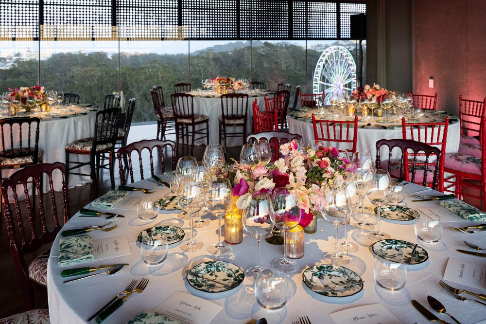Hamon Tower at the de Young during a wedding with tables decorated with flowers