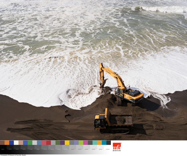 A truck restoring a Pacific coast beach