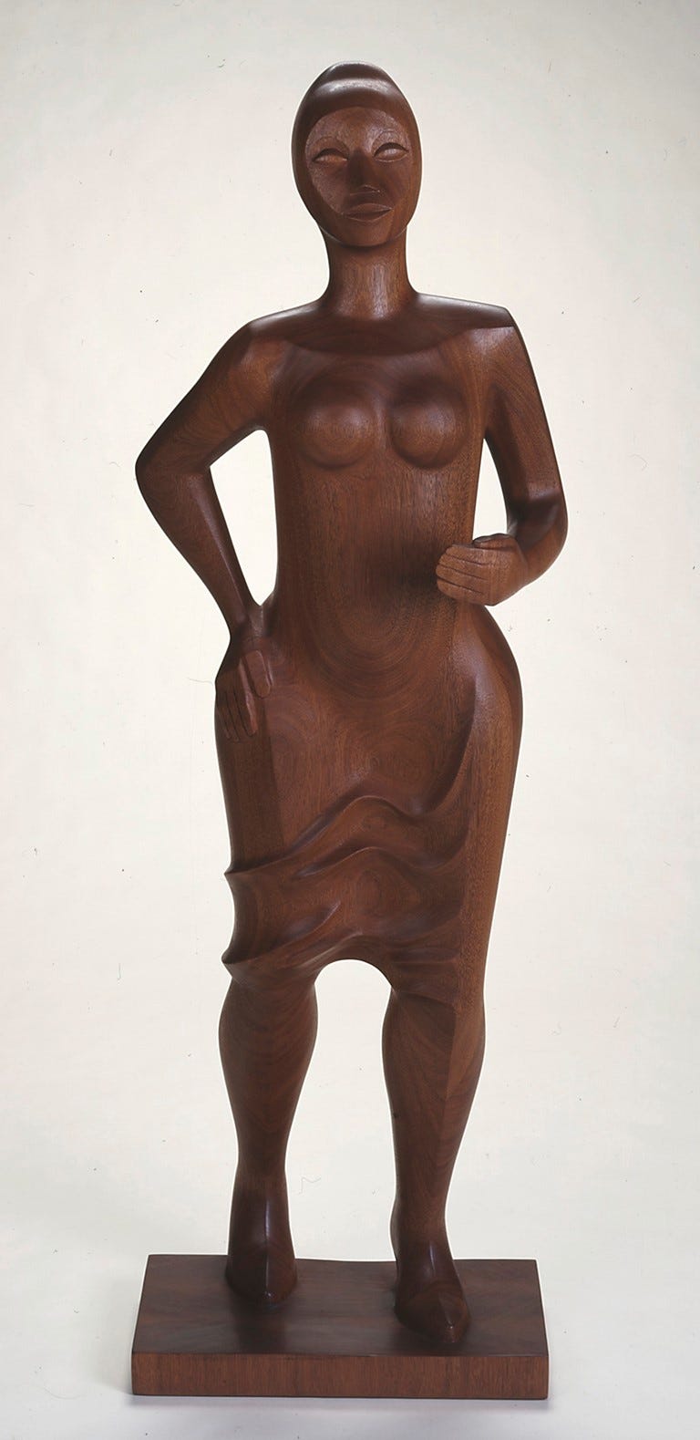 wooden sculpture of a woman