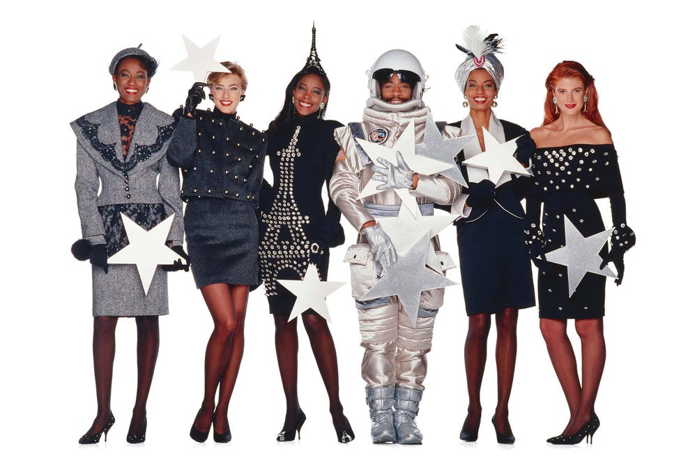 Patrick Kelly and models dressed in space-themed outfits