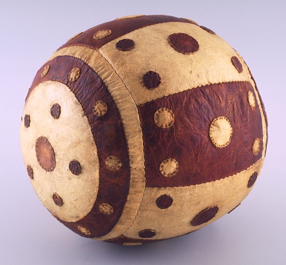 Brown and white ball