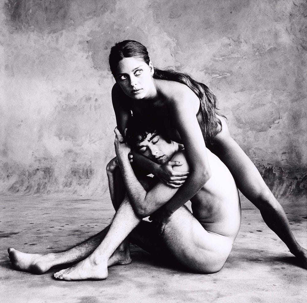 Black and white photograph of two people performing a dance in the nude by Irving Penn