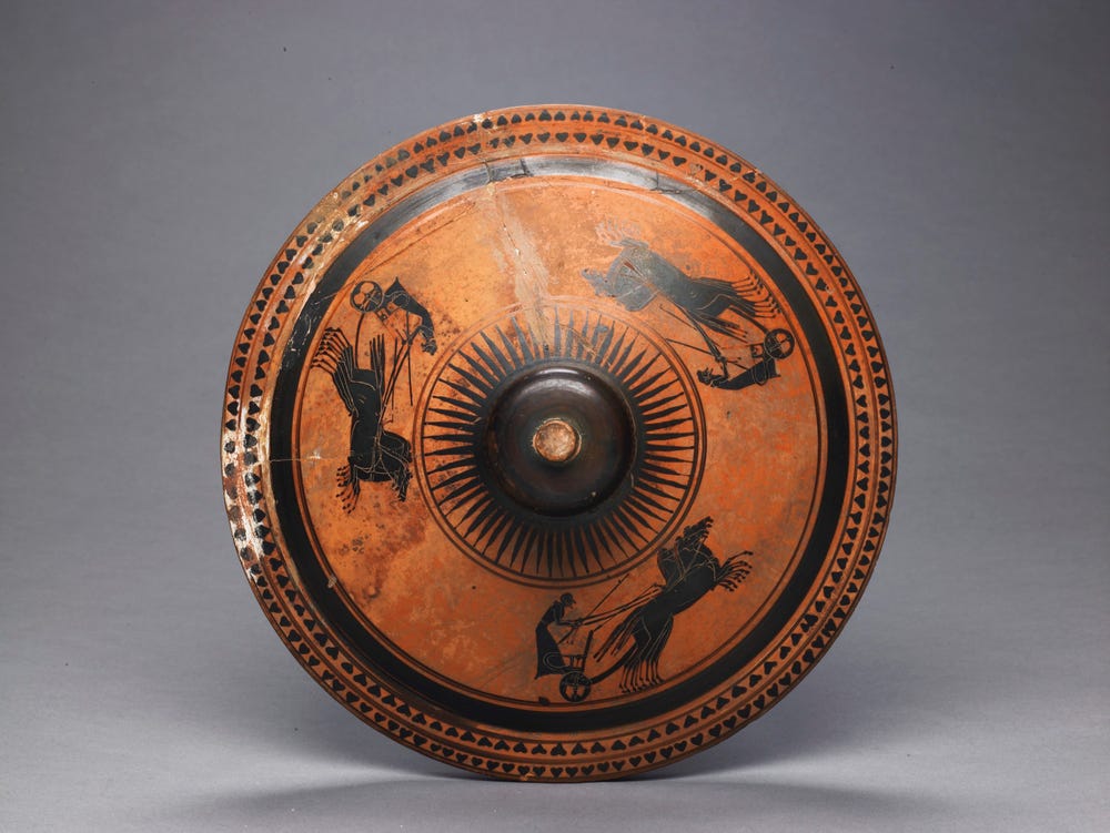 top view of a brown and black amphora with chariot decoration