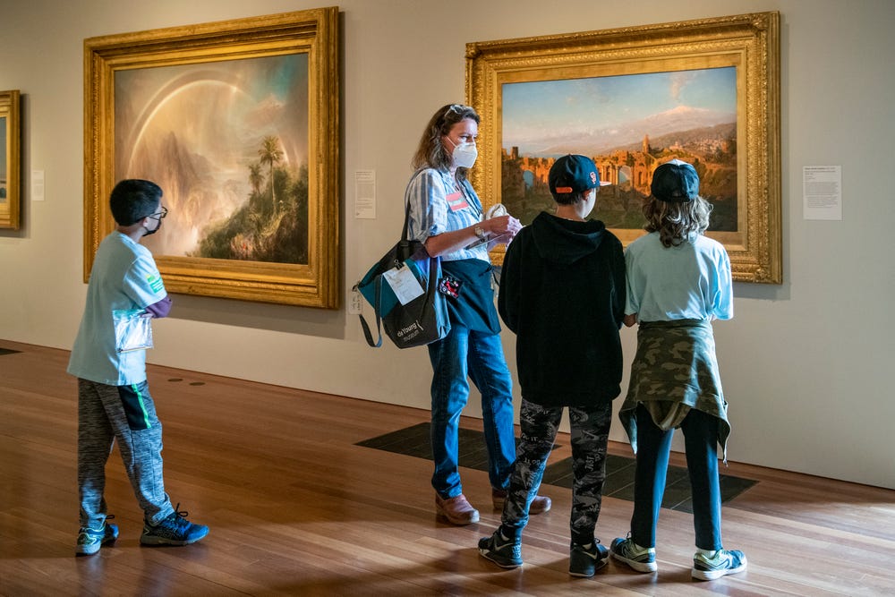 students and teaching artist in the de Young galleries during summer camp