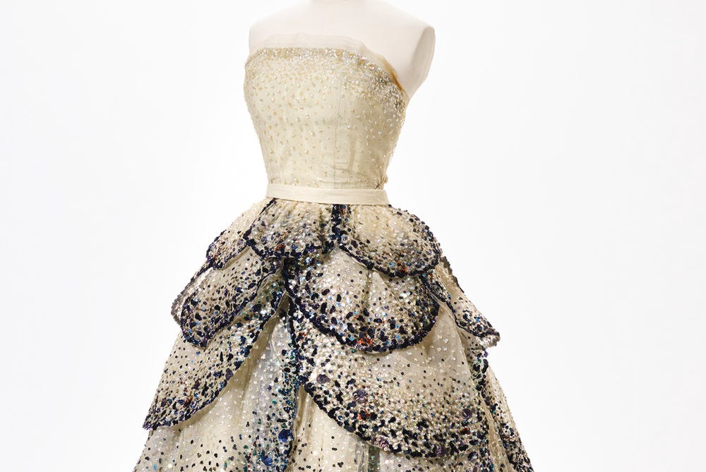 Extravagant dress with a multilayered, sequined skirt