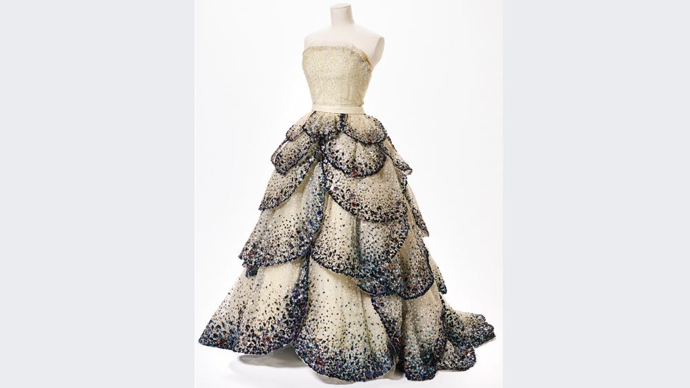 Extravagant dress with a multilayered, sequined skirt