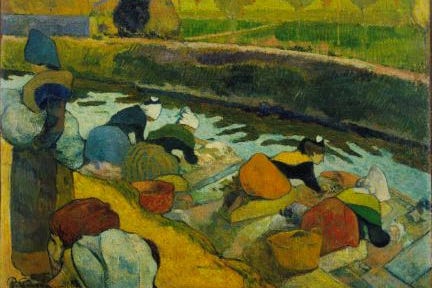 Women washing clothes in a river.