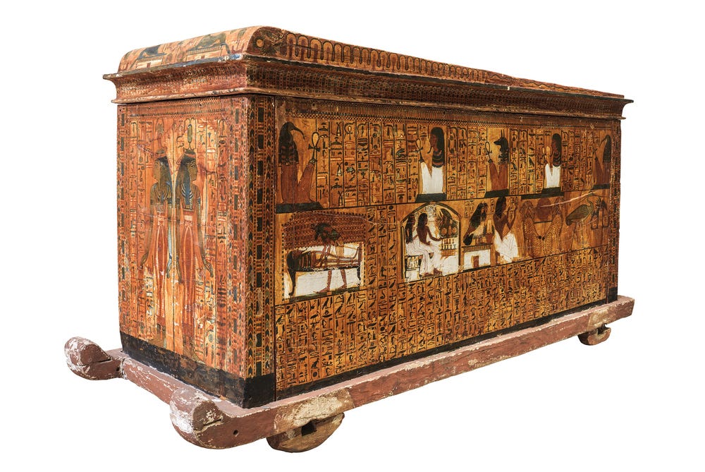 Wood coffin adorned with decorations in the de Young's Ramses exhibition