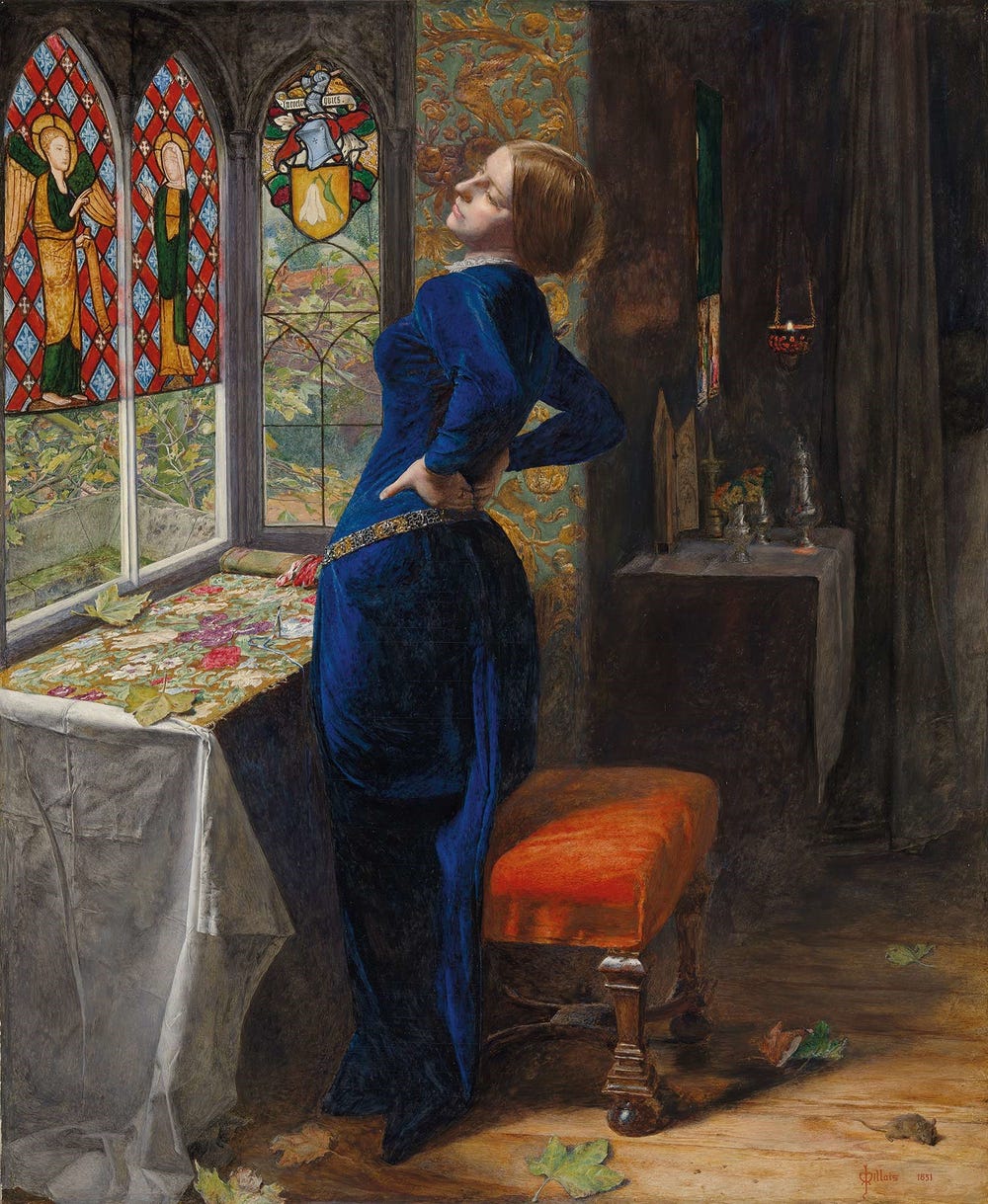 woman in a blue dress with her hands on her lower back in front of a stained glass window