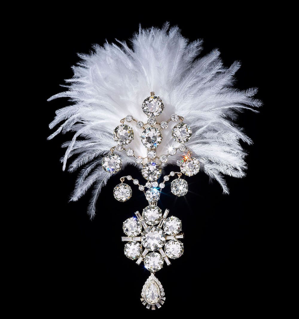 turban ornament with white feathers, white gold, and diamonds