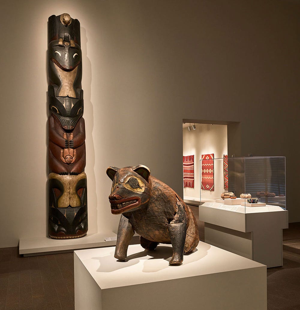 gallery with a wooden bear and totem pole
