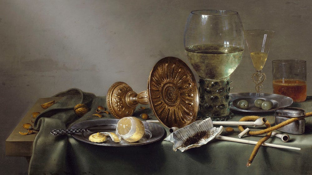 Goblets, fruit, and other objects on a table.
