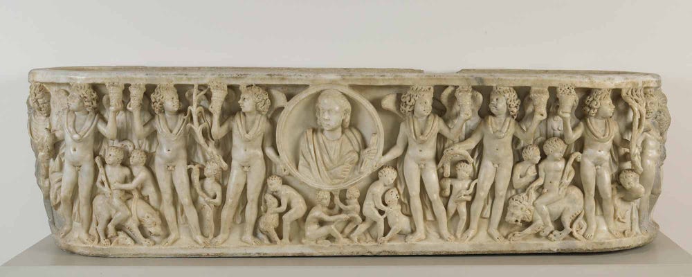 carved marble sarcophagus