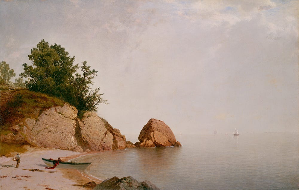 beach landscape with rocks in left foreground