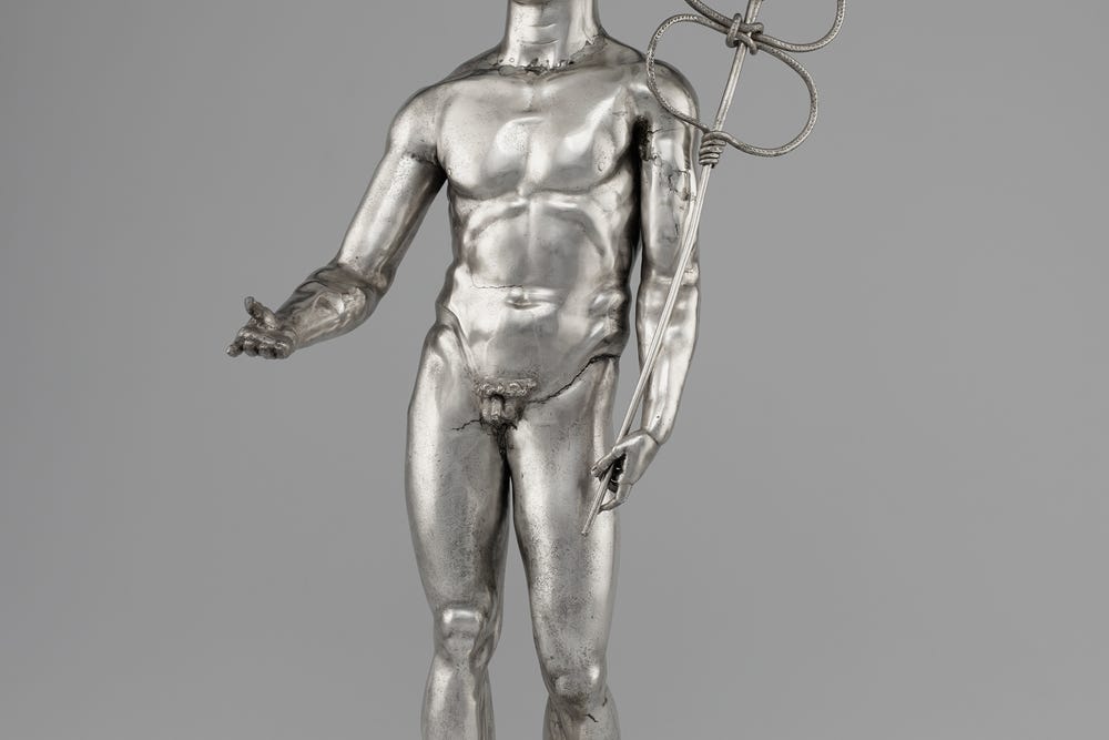 Photograph of silver figure of Roman god Mercury.