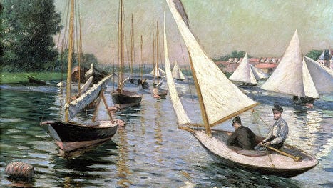 Sailors and sailboats on calm water.