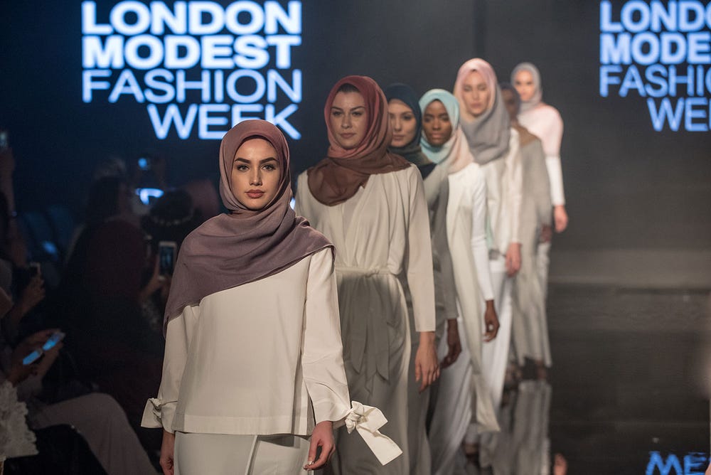 models wearing hijabs walking the runway