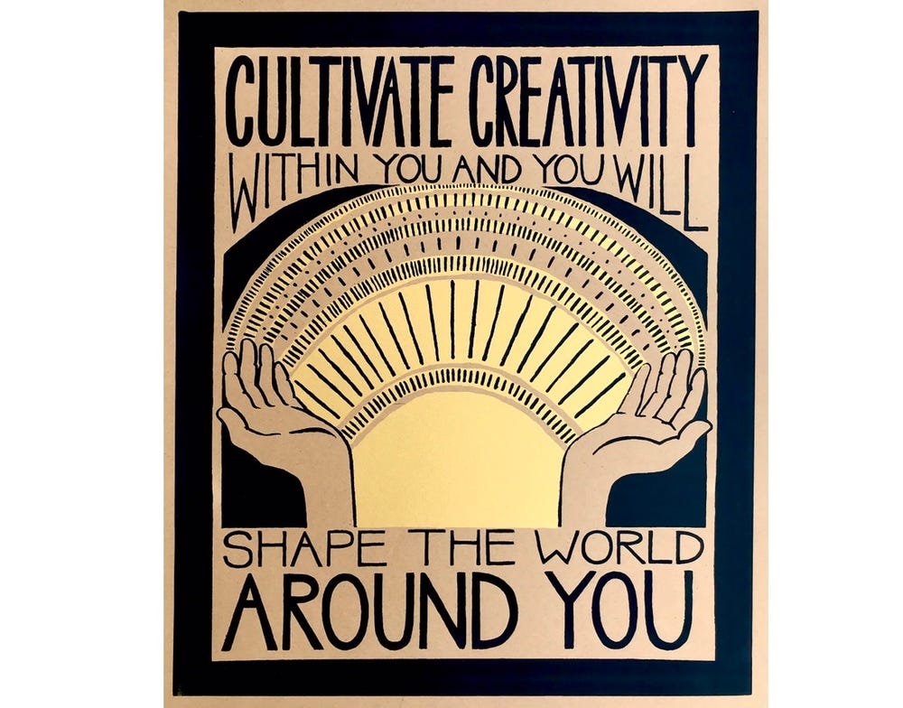 Sign with upraised hands reading “Cultivate creativity within you and you will shape the world around you."