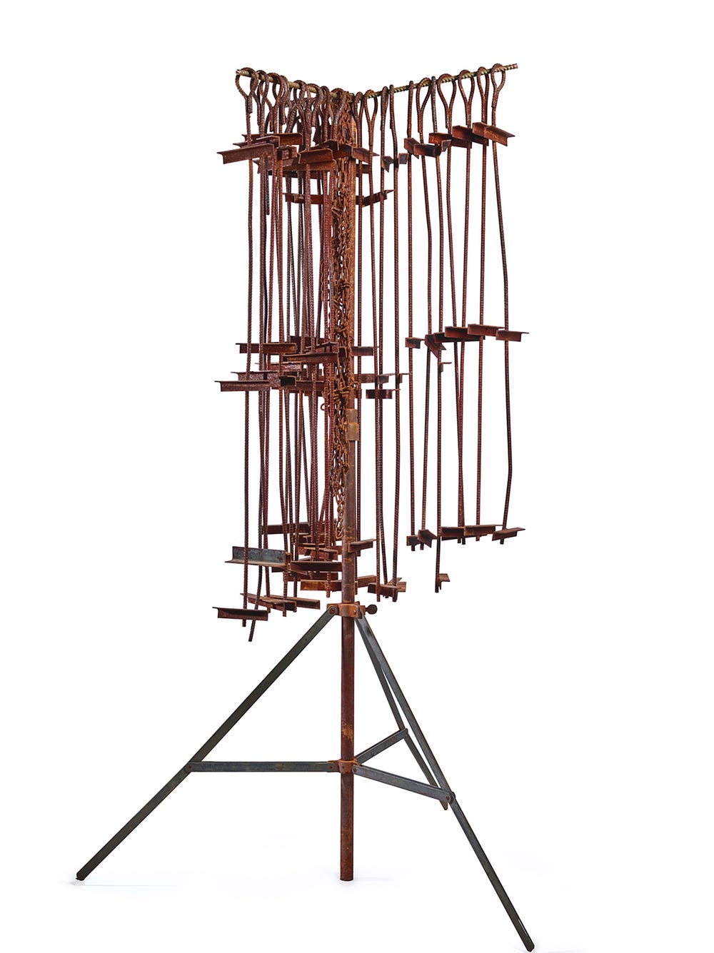 a vertical steel structure with pieces of steel hanging from the top