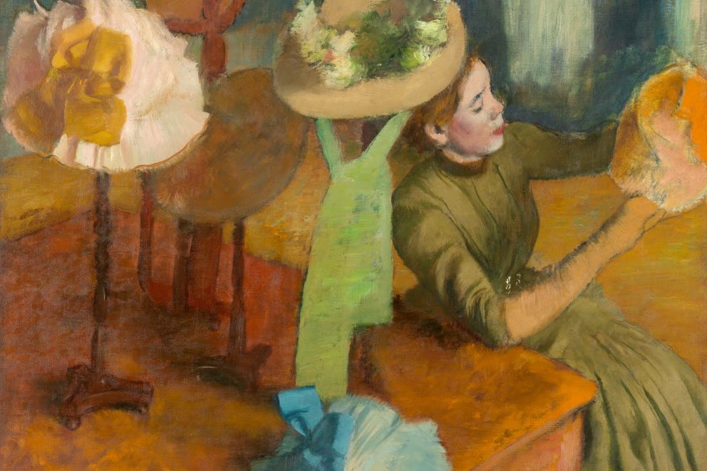 Painting of woman admiring hats in millinery shop.