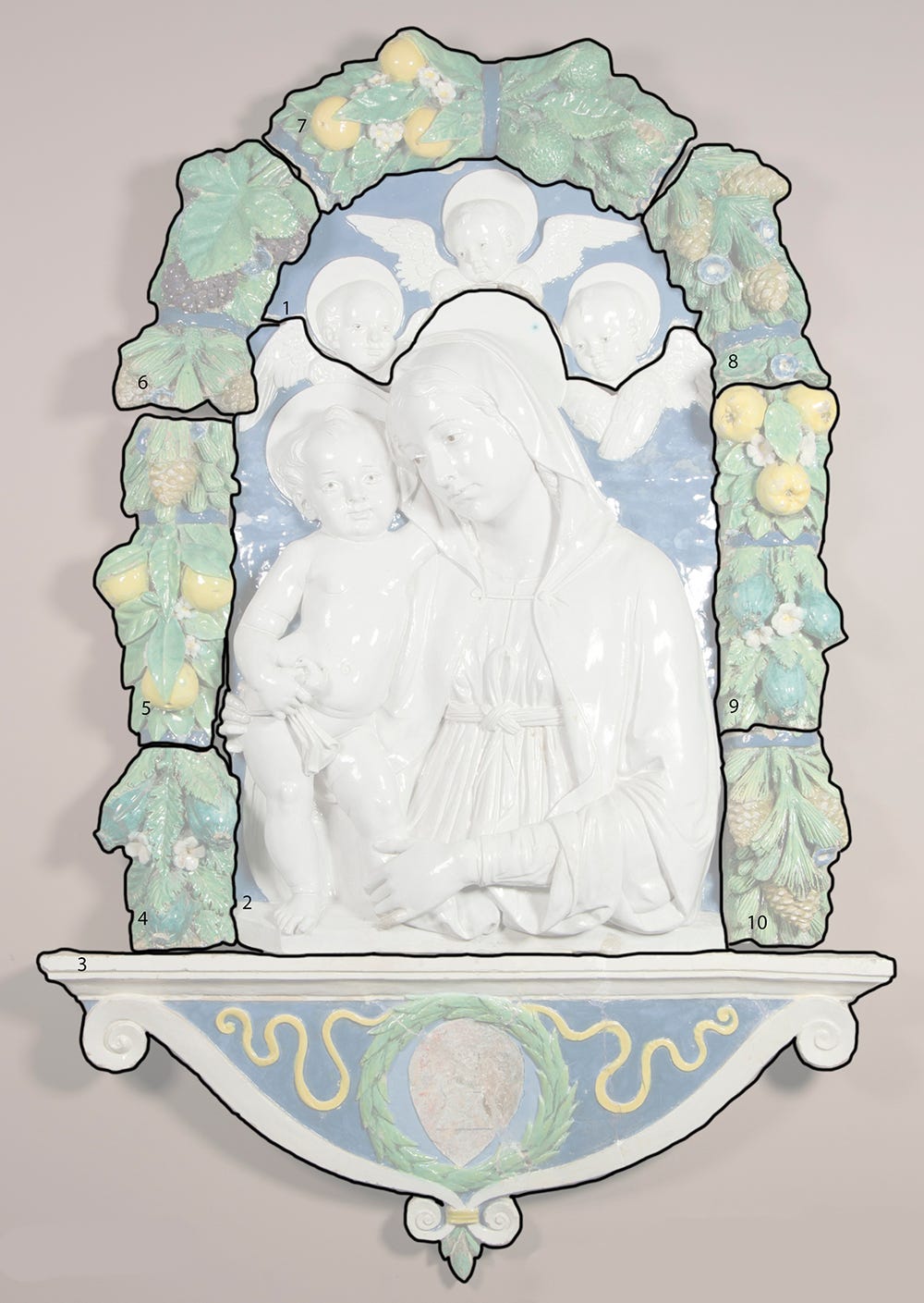 Faint Virgin Mary and Child relief with drawn black overlay dividing piece into sections