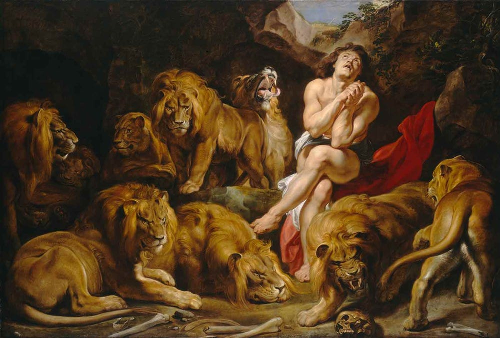 Nearly nude, a man looks heavenward with clasped hands and pleading eyes as a pride lions encircles him