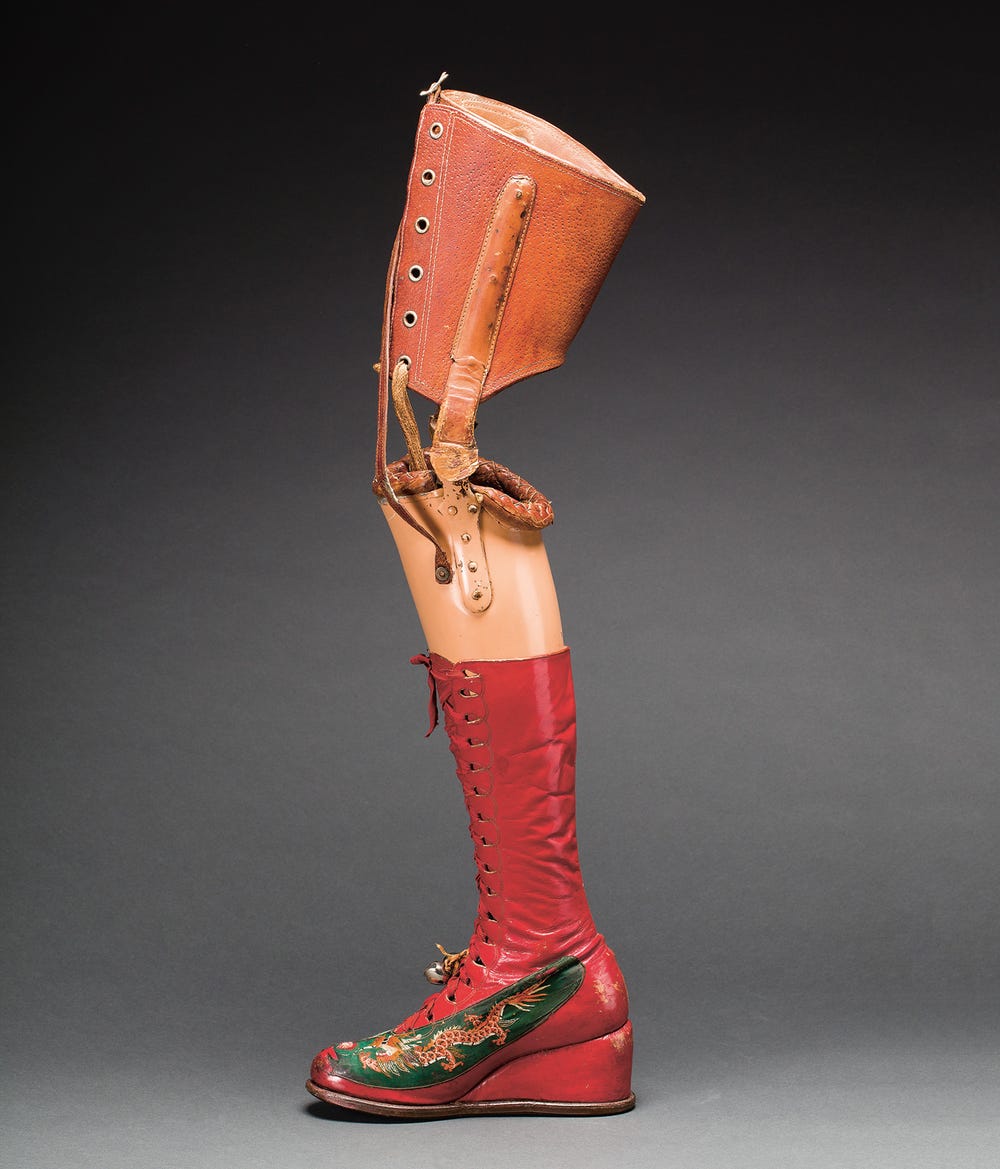 Prosthetic leg with red leather boot