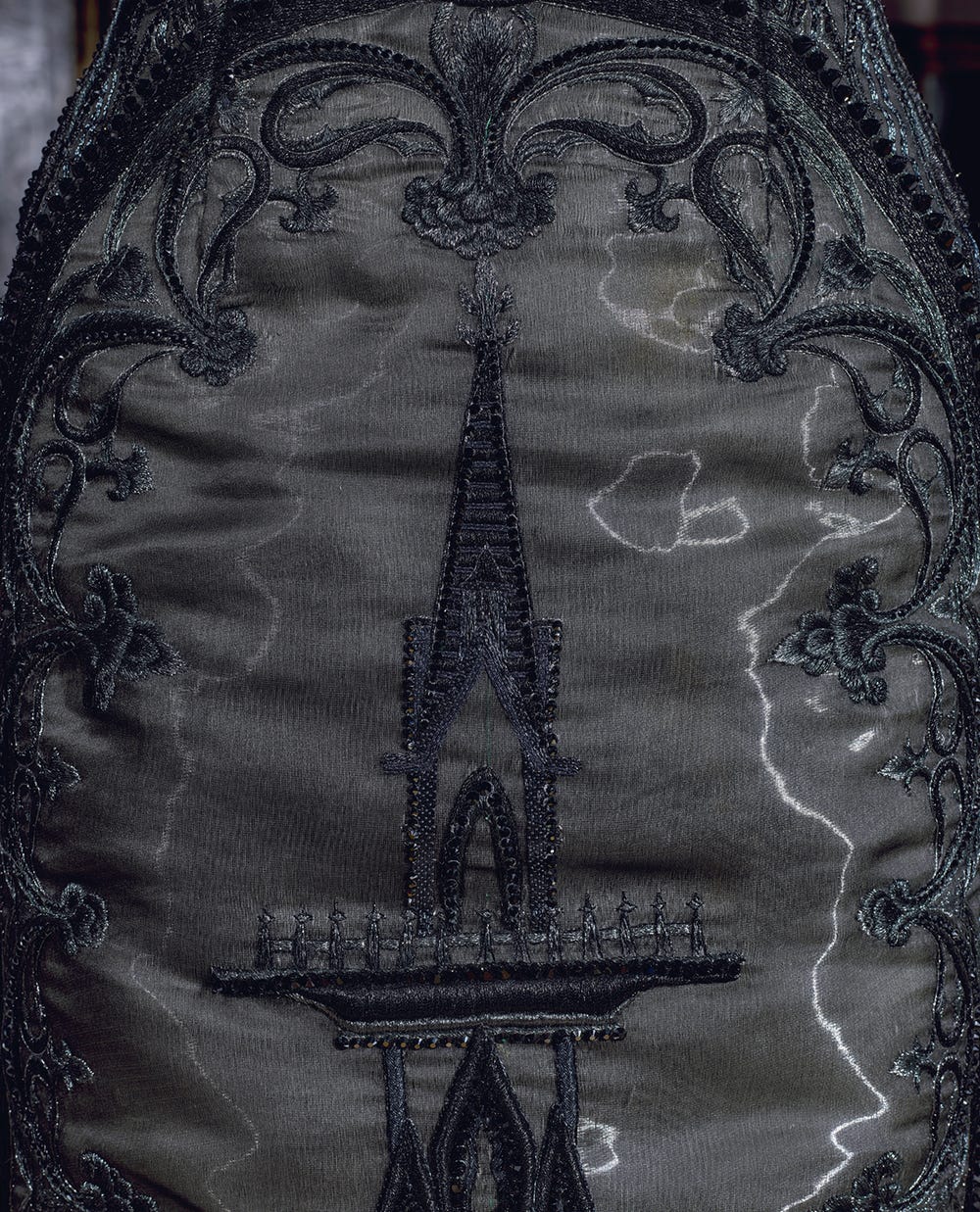 tower embroidered on a black couture dress