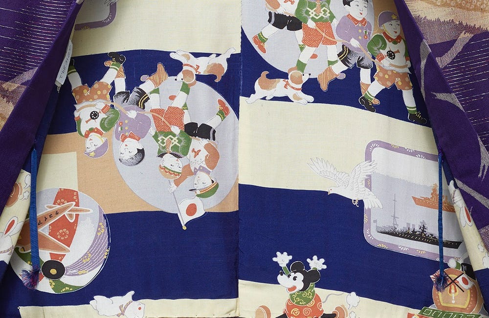 fabric with patriotic children, with a flag and dog, along with a Mickey Mouse figure and warships
