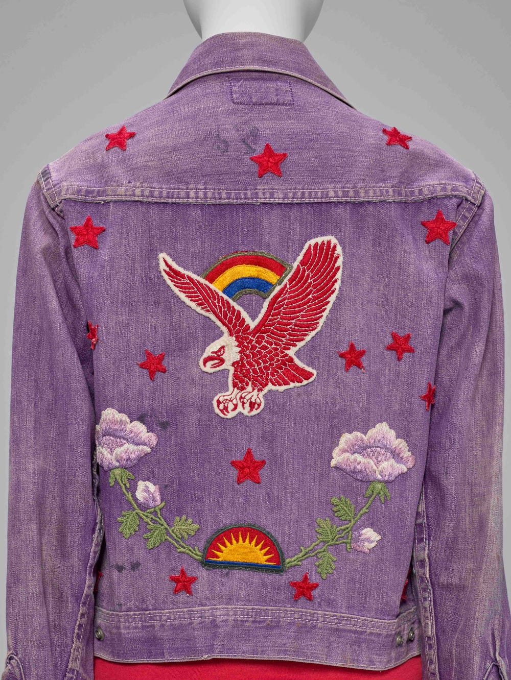 purple jean jacket with patches