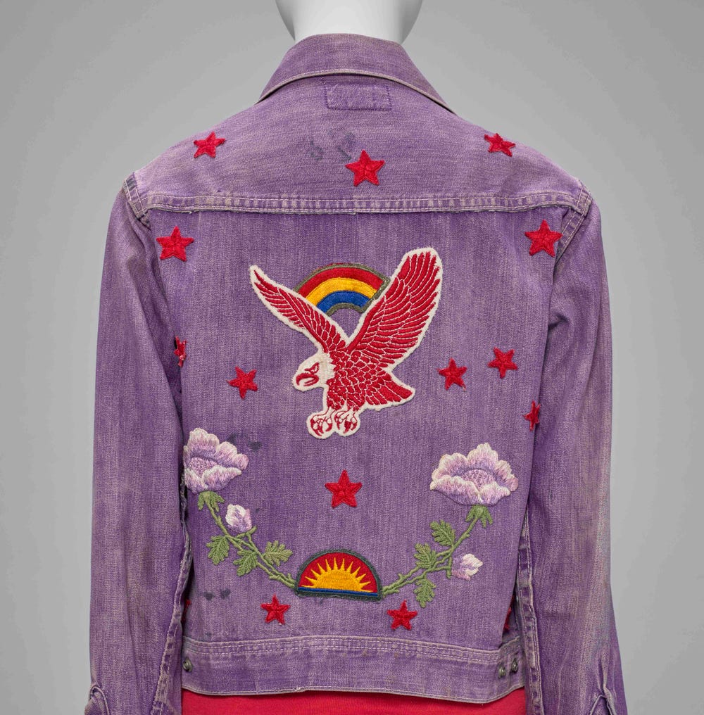 purple jean jacket with patches