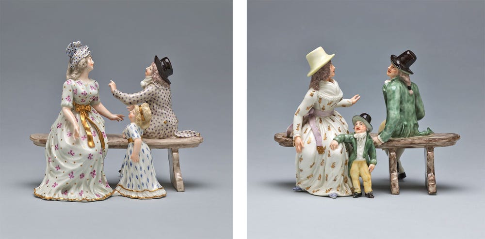 two sets of figurines with families interacting on benches
