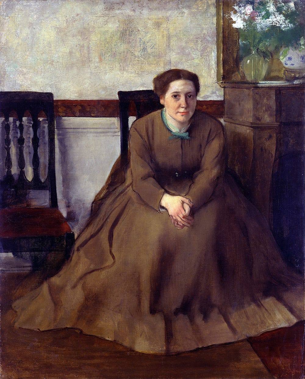 woman in a brown dress sitting