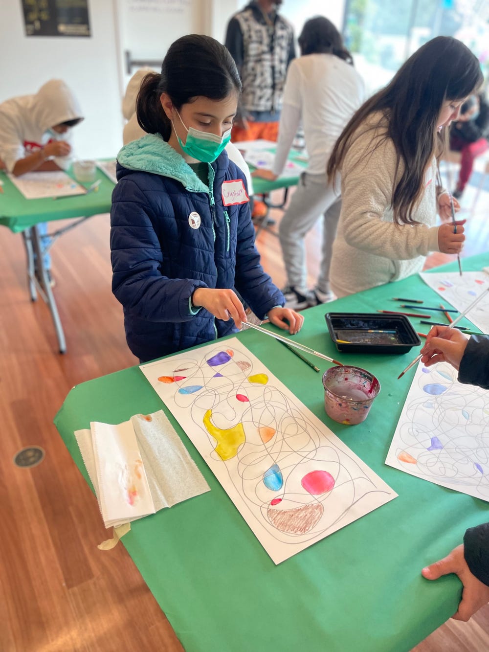 Student making art at the de Young museum