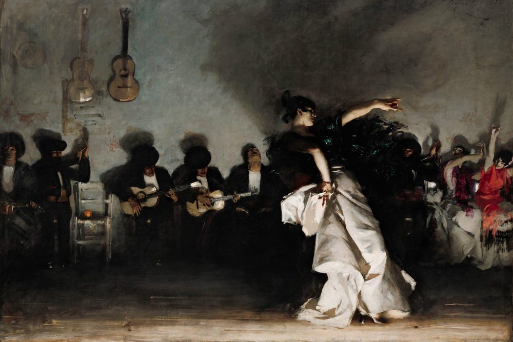 Flamenco dancer dancing in front of musicians during a performance