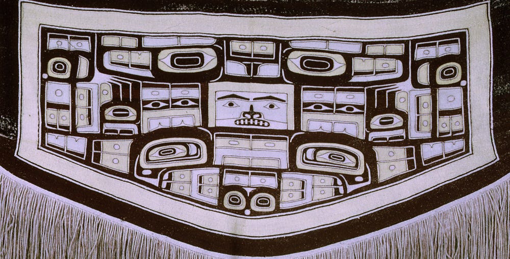 close-up of blanket with diving whale motif