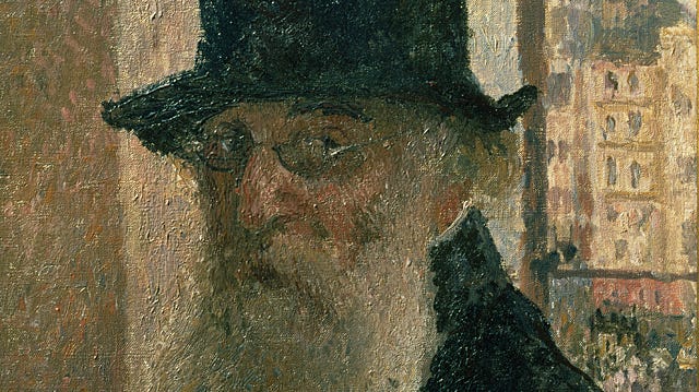 Portrait of older bearded man wearing a hat.