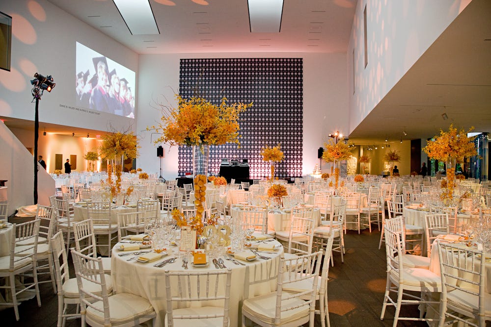 de Young Wilsey Court set up with decorative tables during an event