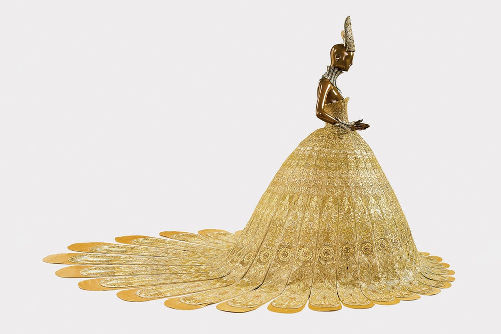 mannequin wearing gold dress